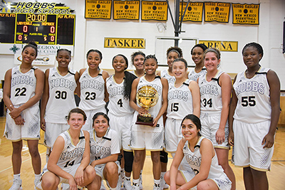 girls holding trophy