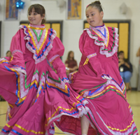 two dancers in pink dresses