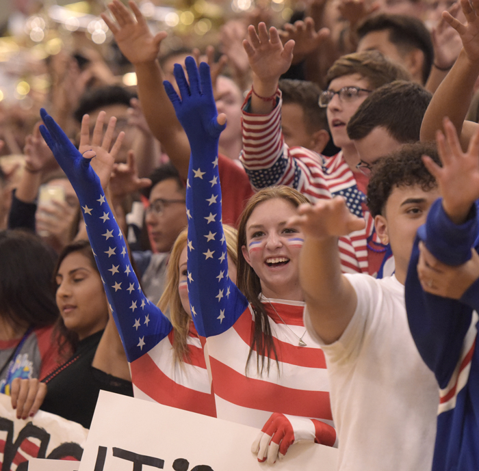 students waving