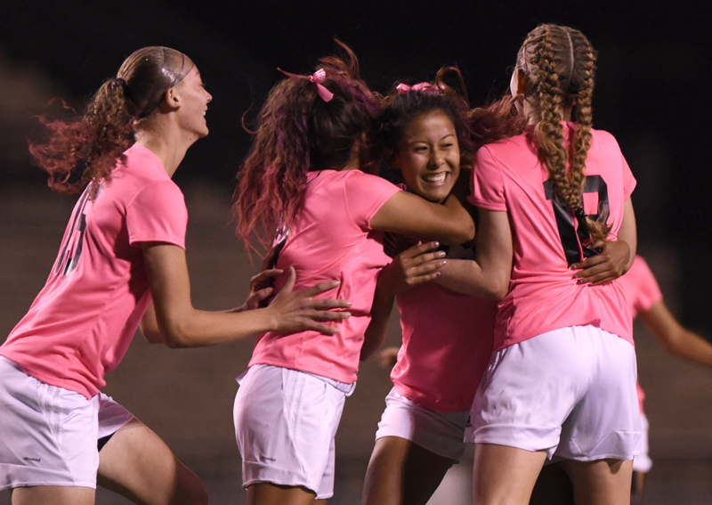 soccer girls hugging