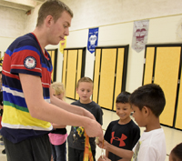 tharon drake holding silver medal