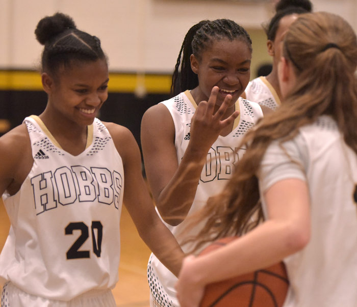 girl player holding up three fingers