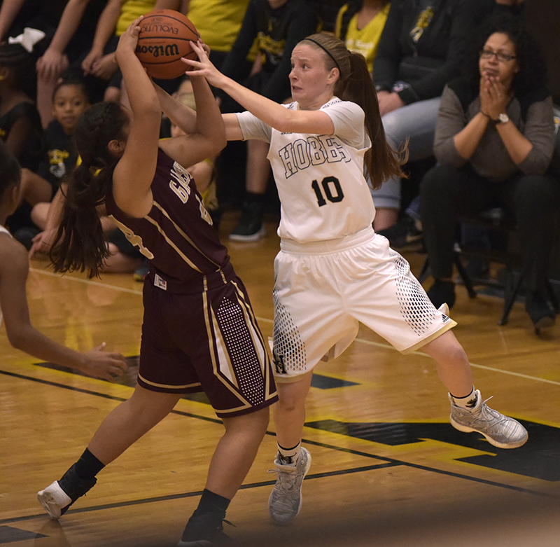 girl player trying to grab ball