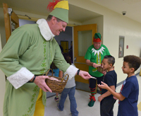 superintendent handing out candy cane