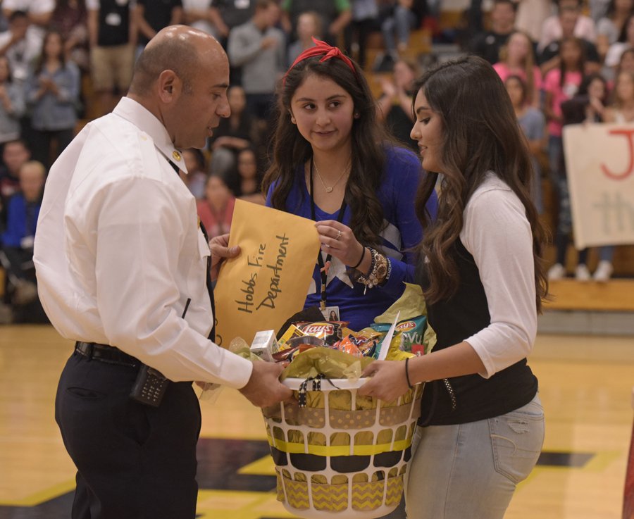 fire chief receiving basket of goods