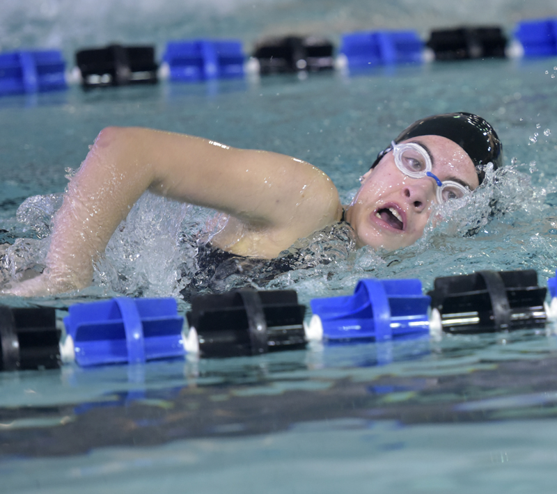 girl swimming with head out of water