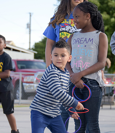 little boy tossing ring