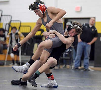 wrestler throwing another wrestler