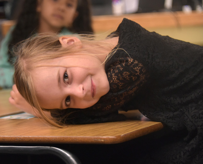 student with head on desk