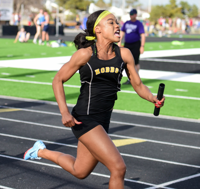 girl running with baton