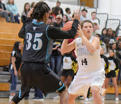 girl getting ready to pass ball