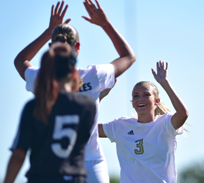 two players high fiving