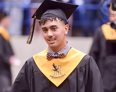 student in cap and gown