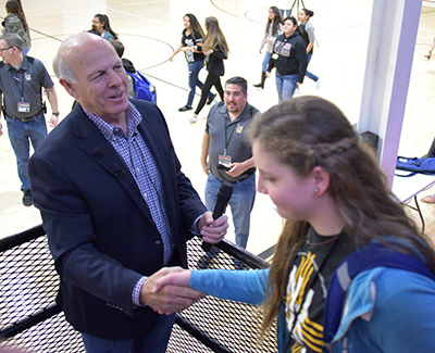 steve pearce shaking student hand