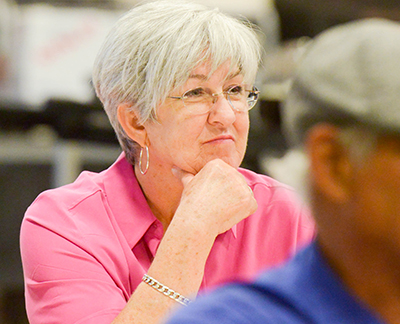 lady sitting at table looking ahead