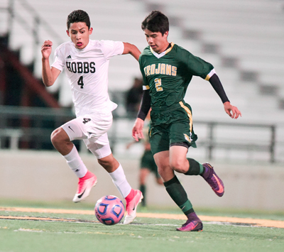 two players chasing soccer ball