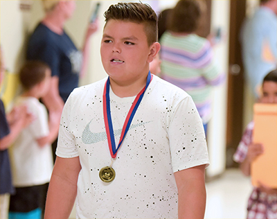 student with medallion