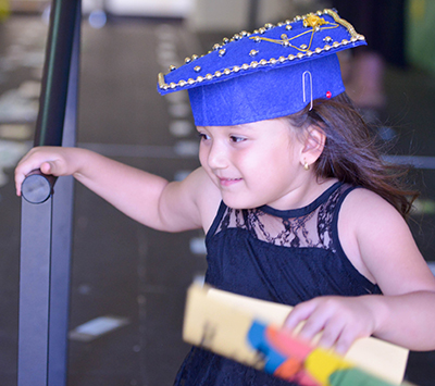 little girl with diploma