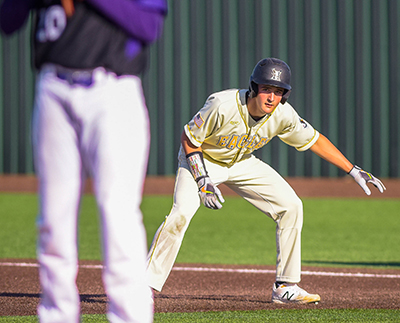 first baseman cheating off base while watching pitcher