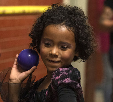 girl getting ready to throw ball