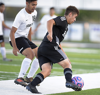 player dribbling ball up sideline