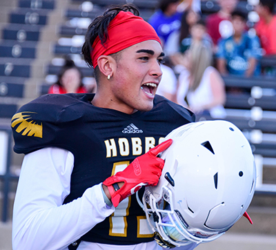 football player with helmet off