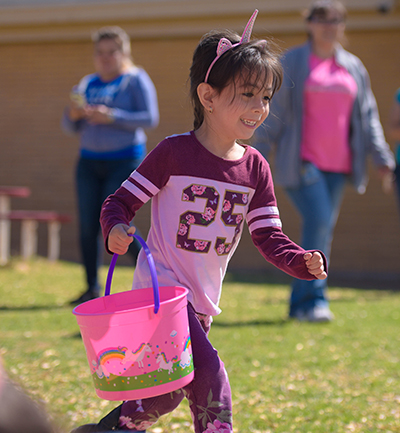 girl with easter basket running