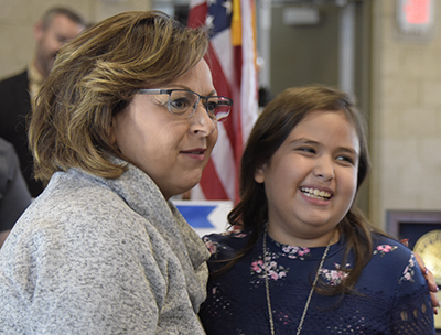 girl and governor smiling