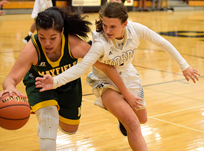 player trying to steal ball from another player