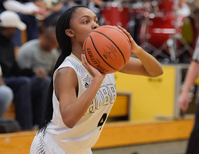 girl getting ready to shoot bball