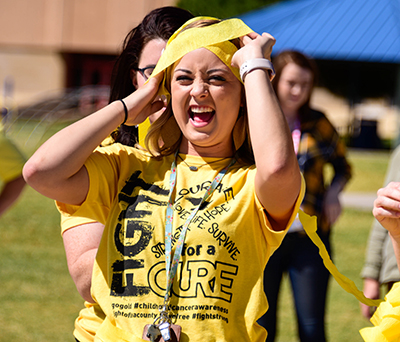 teacher laughing with something on her head