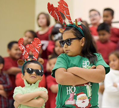 girl in antlers with arms crossed