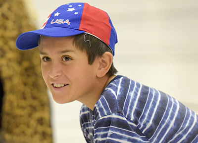 smiling boy in baseball cap