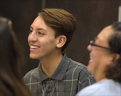 smiling student at table