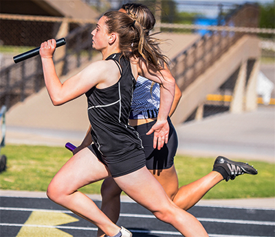 girl running with baton