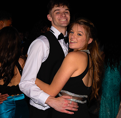 boy and girl smiling while dancing