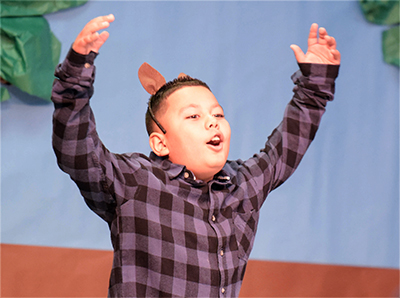 kid acting with wolf ears on