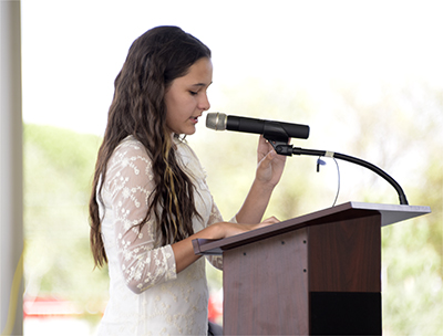 student standing at podium