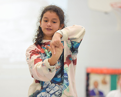 student dancing with hands