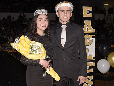 guy and girl in crowns and formal wear