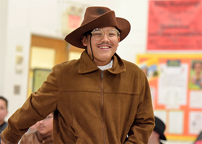 guy with hat and monocle dressed like teddy roosevelt