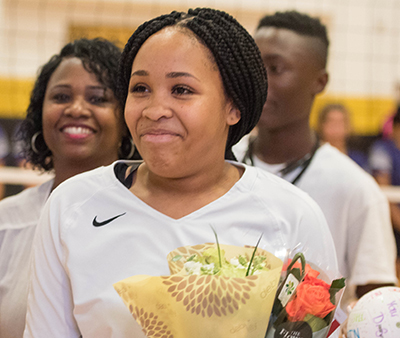 smiling player with flowers