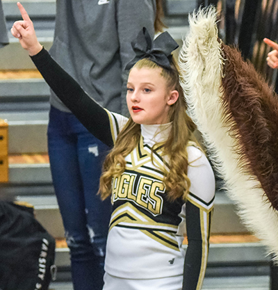 Cheerleader with finger in air