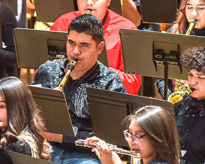 student in band playing saxaphone