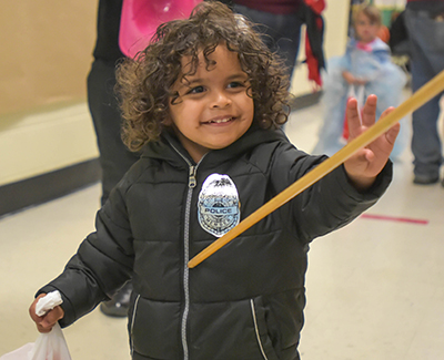 smiling kid with bag of candy