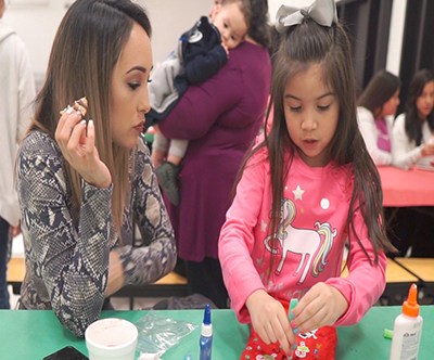 mom and daughter working on stocking