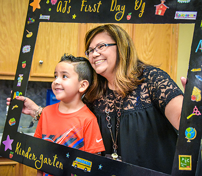 student and teacher smiling in picture frame