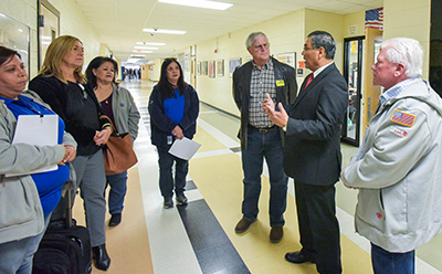 a group of people talking in hall