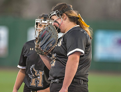 girl talking into her glove