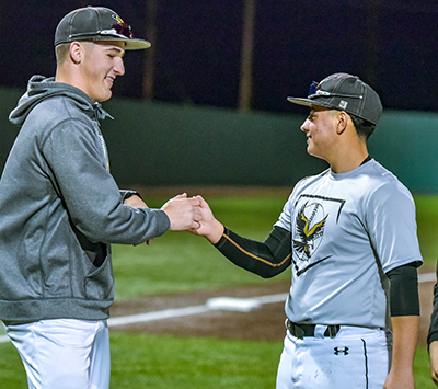 two players fist bumping